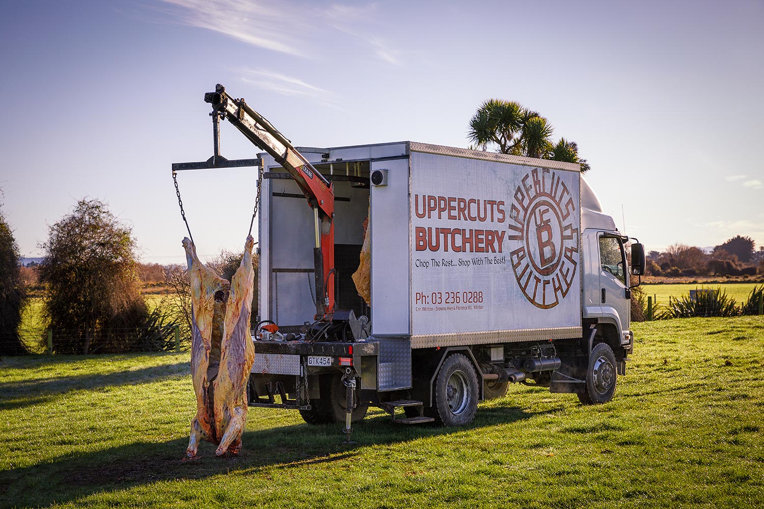 Uppercuts Butchery homekill truck with homekill meat hung off back crane.
