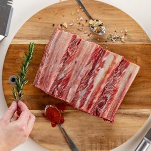Short ribs surrounded by herbs and spices