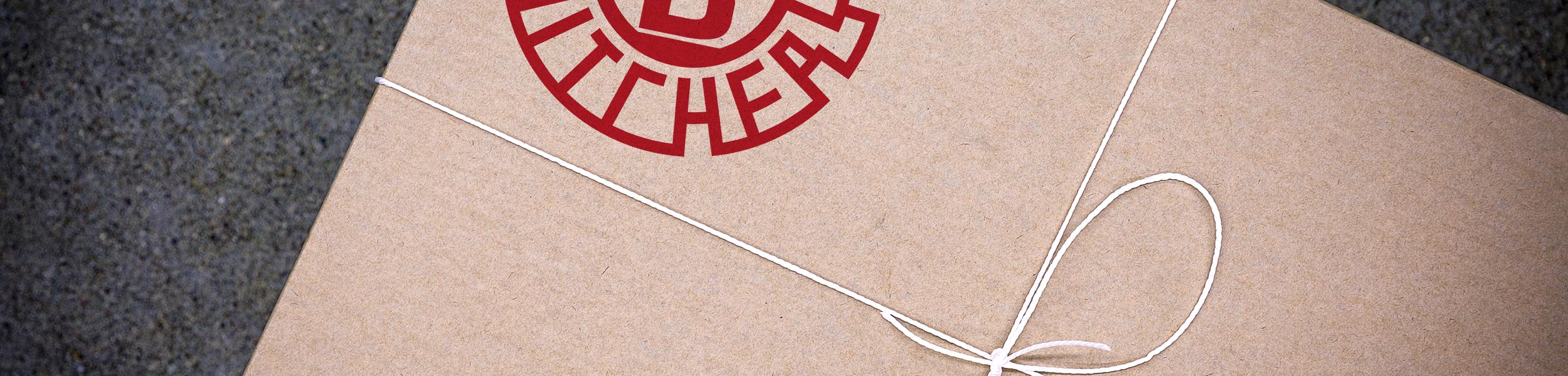 Uppercuts logo on cardboard box with string.